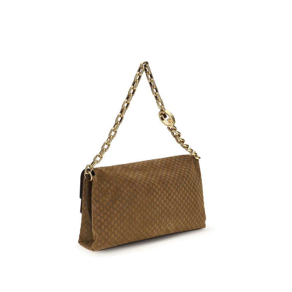 Large Shoulder Flap Handbag by Gucci for women in raffia & suede leather beige, camel & signature features a refined silhouette, showcasing a secure flap, magnetic & button, organized , and versatile shoulder-strap for a refined finish.
