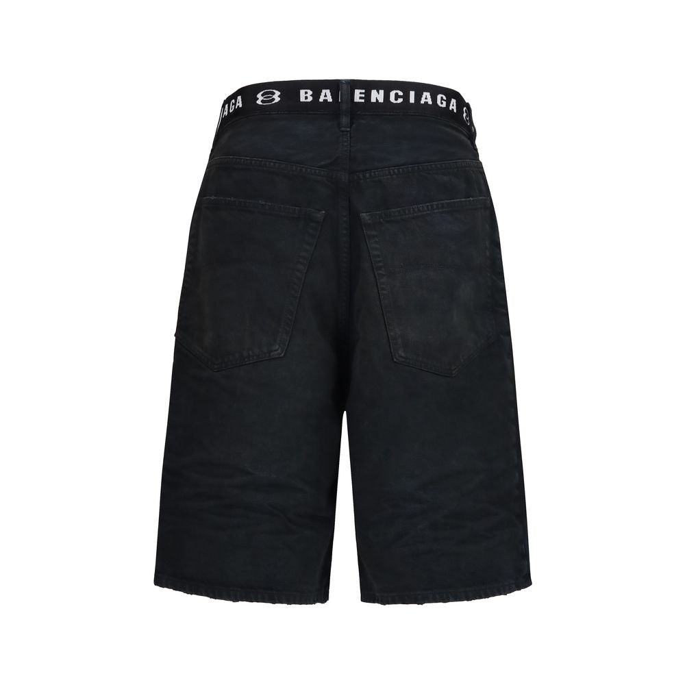 Denim Shorts by Balenciaga for men in denim cotton black & signature features an utilitarian chic regular-fit with a short and mid rise, creating a utilitarian chic silhouette perfect for elevated casual styling.