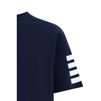 T-Shirt by Thom Browne for men in cotton blue, monogram & striped showcases a fashionable silhouette, elegantly detailed with a fashionable and crew neckline for a sophisticated, high-fashion look.