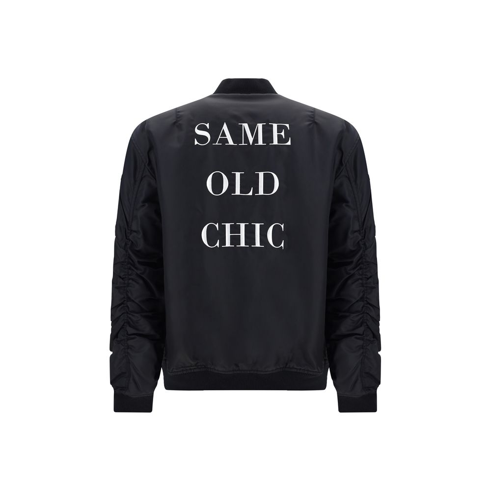 Bomber Jacket by Moschino for men in polyamide black & print features a city-ready silhouette, detailed with pockets & insulated and a city-ready crew neckline.