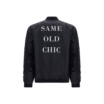 Bomber Jacket by Moschino for men in polyamide black & print features a city-ready silhouette, detailed with pockets & insulated and a city-ready crew neckline.
