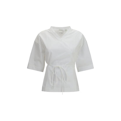 Shirt by Calvin Klein for women in cotton white showcases a sleek silhouette, elegantly detailed with a sleek v-neck neckline and short-sleeve for a sleek finish.