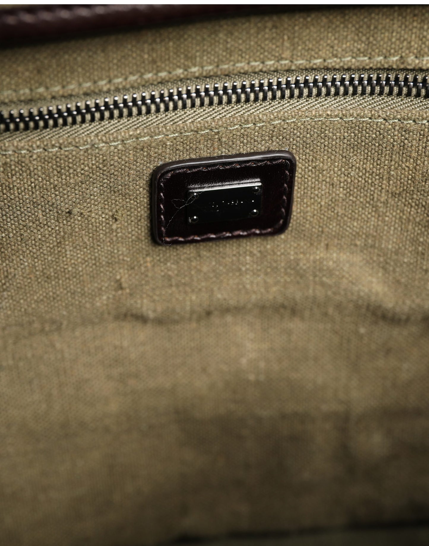 Shoulder Tote Clutch Convertible Handbag by Dolce & Gabbana for men in leather & metal dark-green & military-green features a polished silhouette with a secure buckle, ample , and polished shoulder-strap for a sophisticated look.
