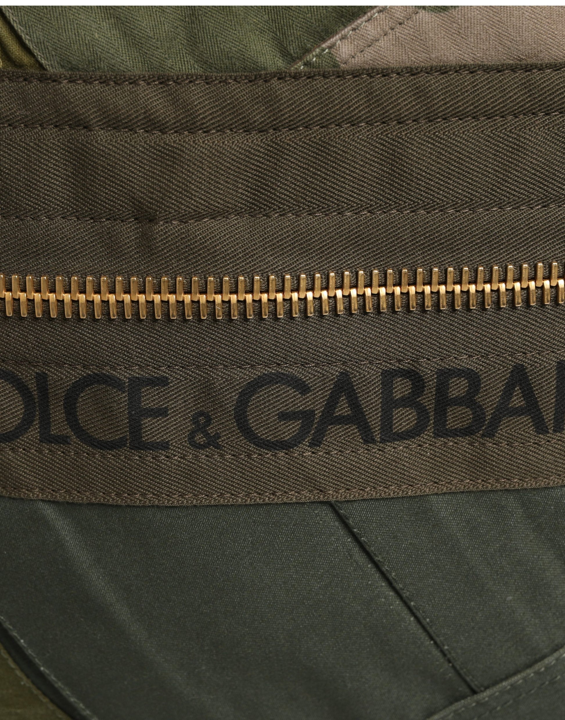 Mini Rucksack Backpack by Dolce & Gabbana for men in calf leather viscose & cotton military-green & patchwork showcases an architectural Calf Leather Viscose Cotton Mini Rucksack Backpack design, featuring a secure zipper, ample , and architectural shoulder-strap & backpack-strap for a sophisticated look.