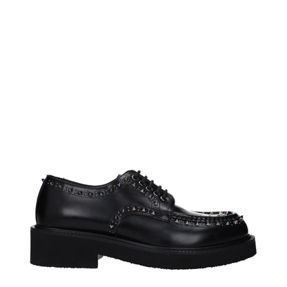 Mid-Heel Lace-Up Shoes by Valentino Garavani for men in leather & rubber black showcases a impeccable silhouette as Men's Leather & Rubber Mid-Heel Lace-Up Shoes, artfully designed with a impeccable 4-5-cm-heel mid-heel and refined round toe style for a impeccable finish.