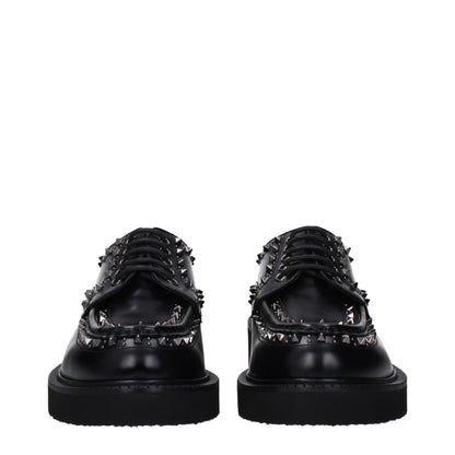 Mid-Heel Lace-Up Shoes by Valentino Garavani for men in leather & rubber black features an effortless chic silhouette, showcasing the Men's Leather & Rubber Mid-Heel Lace-Up Shoes design with an effortless chic 4-5-cm-heel mid-heel and a round toe style for a effortless chic look.