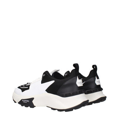 Athletic Sneakers by Valentino Garavani for men in fabric black showcases a architectural silhouette, artfully capturing the essence of the Men's Athletic Fabric Sneakers with its signature architectural athletic style construction.