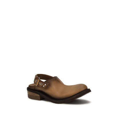 Mules Flat Shoes by Miu Miu for women in bos taurus calf leather brown presents a impeccable silhouette as Women's Bos Taurus Calf Leather Mules Flat Shoes, artfully designed with a and a impeccable round toe style for a refined, upscale finish.