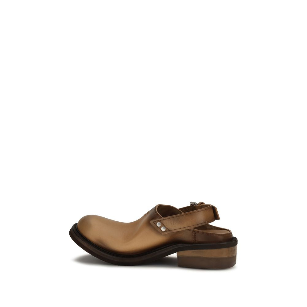 Mules Flat Shoes by Miu Miu for women in bos taurus calf leather brown showcases a resplendent Women's Bos Taurus Calf Leather Mules Flat Shoes aesthetic with a and round toe style.