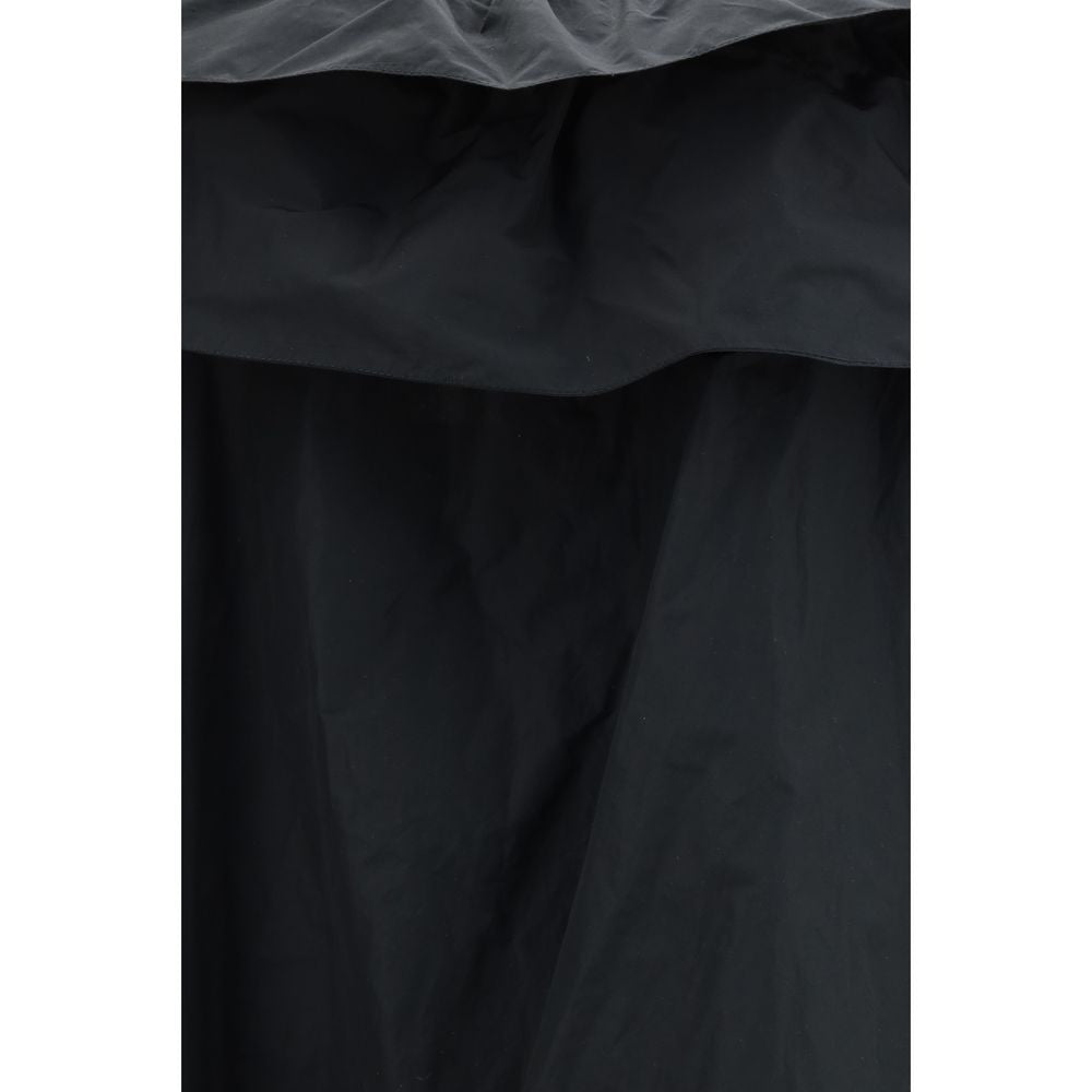 Dress by Saint Laurent for women in cotton polyester canvas black showcases a striking silhouette, elegantly detailed with a , refined , and a striking long for a striking finish.