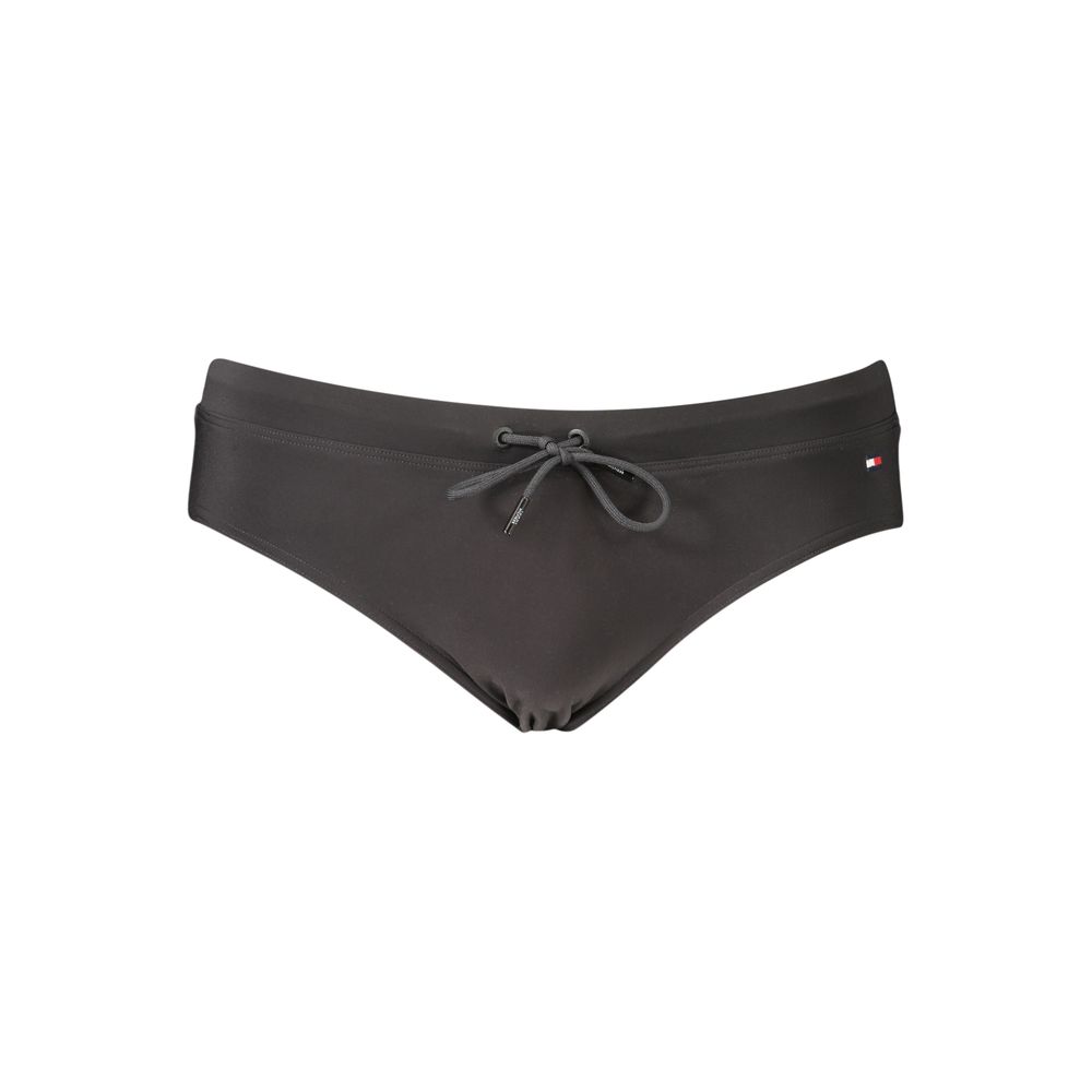 Swim Briefs by Tommy Hilfiger for men in stretch polyester black features a refined silhouette, showcasing the refined design of this Men's Stretch Polyester Swim Briefs with a refined fit.
