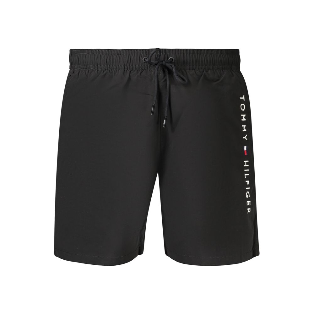 Swim Shorts by Tommy Hilfiger for men in polyester black features an dramatic silhouette that defines the luxurious aesthetic and refined cut of the Men's Polyester Swim Shorts.