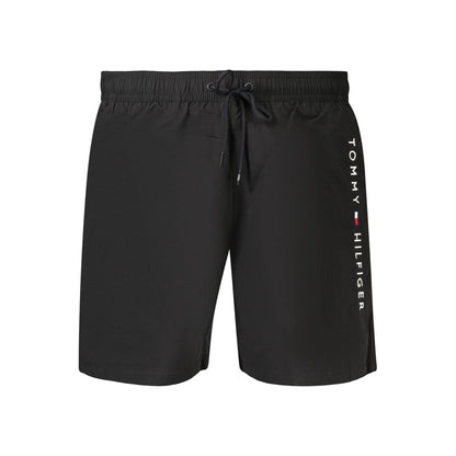 Swim Shorts by Tommy Hilfiger for men in polyester black features an dramatic silhouette that defines the luxurious aesthetic and refined cut of the Men's Polyester Swim Shorts.