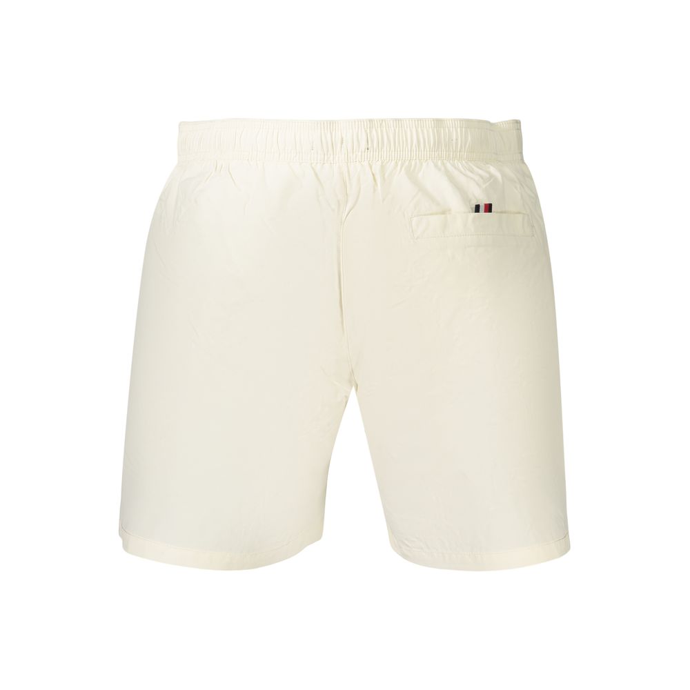 Swim Shorts by Tommy Hilfiger for men in polyester beige features an dramatic silhouette that defines the luxurious aesthetic and refined cut of the Men's Polyester Swim Shorts.