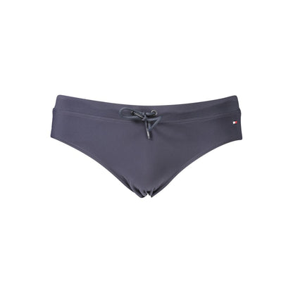 This Swimwear by Tommy Hilfiger for men in stretch polyester blue & signature showcases a eye catching silhouette from the Men's Stretch Polyester Swimwear collection, featuring a eye catching cut designed for poolside elegance.
