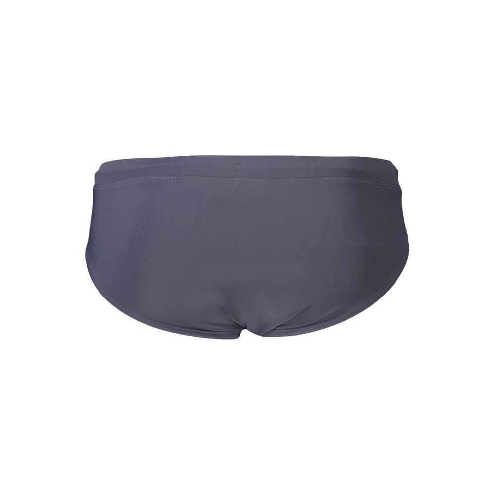 Swimwear by Tommy Hilfiger for men in stretch polyester blue & signature features an resort ready silhouette that elegantly defines the Men's Stretch Polyester Swimwear with a sophisticated cut and resort ready finish.