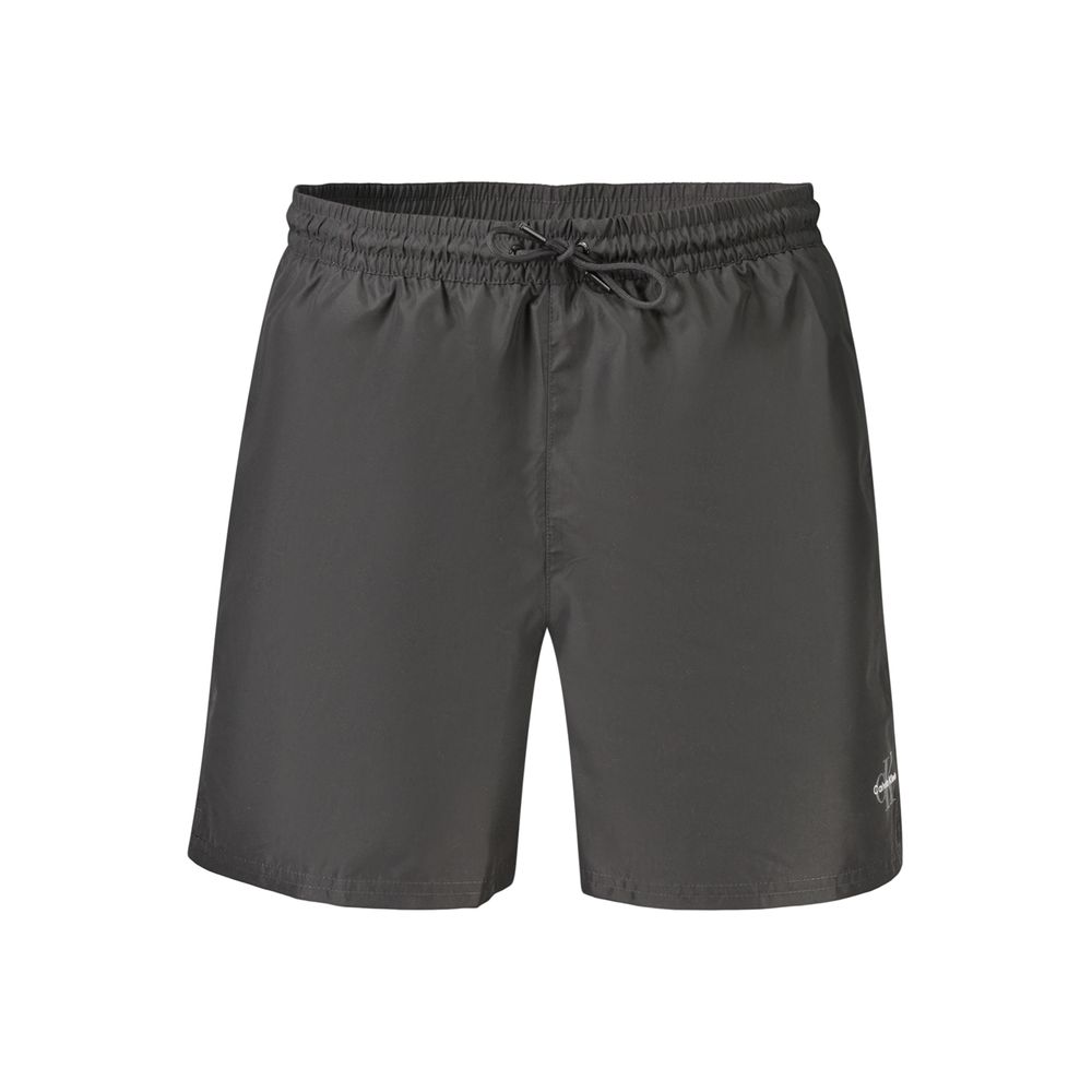 Swim Shorts by Calvin Klein for men in polyester and black showcases a sinuous silhouette, expertly cut for a sinuous fit as part of the Waves Men's Polyester Swim Shorts collection.