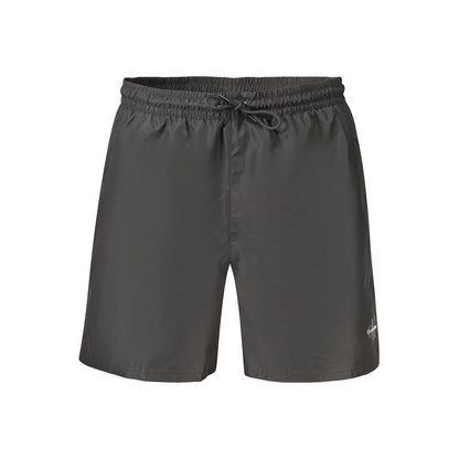 Swim Shorts by Calvin Klein for men in polyester and black showcases a sinuous silhouette, expertly cut for a sinuous fit as part of the Waves Men's Polyester Swim Shorts collection.