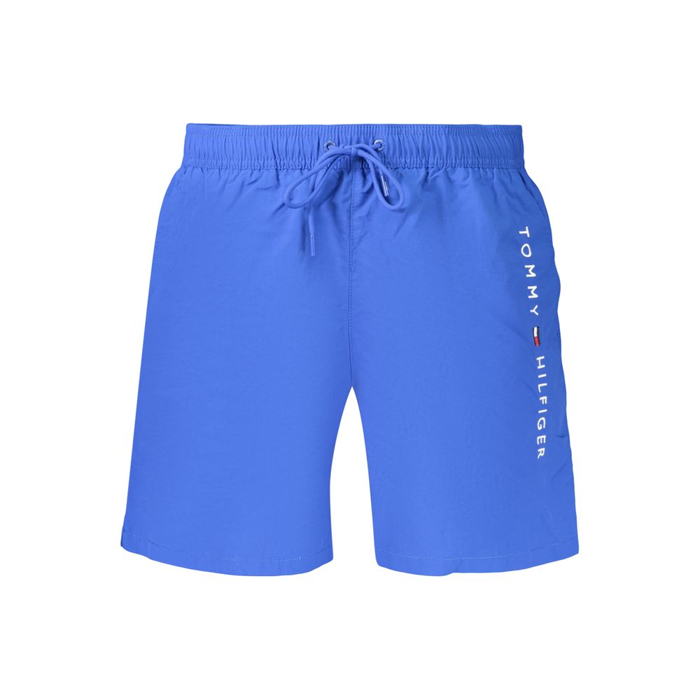 Swim Shorts by Tommy Hilfiger for men in polyester blue & signature features a resort ready silhouette, perfectly capturing the resort ready aesthetic of Men's Polyester Swim Shorts with a resort ready finish.