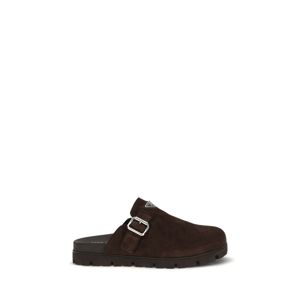 This Flat Mule Mules Strap Shoes by Prada for men in bos taurus suede calf leather brown features an exquisite silhouette from the Men's Bos Taurus Suede Calf Leather Flat Mule Mules Strap Shoes collection, defined by a sophisticated flat and elegant round toe style.