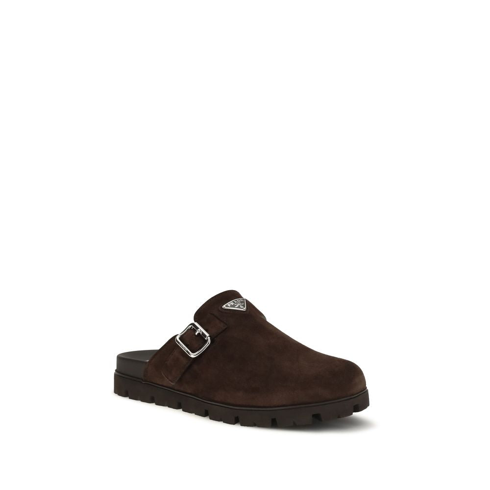 Flat Mule Mules Strap Shoes by Prada for men in bos taurus suede calf leather brown features an effortless chic silhouette, showcasing the Men's Bos Taurus Suede Calf Leather Flat Mule Mules Strap Shoes design with an effortless chic flat and a round toe style for a effortless chic look.