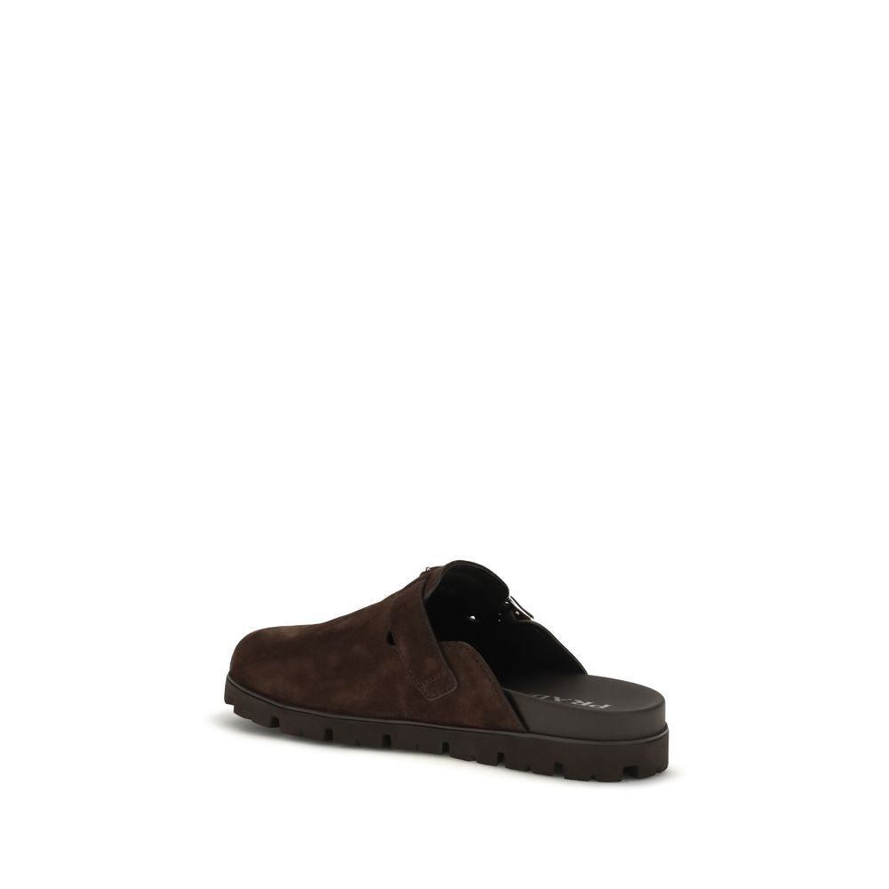 Flat Mule Mules Strap Shoes by Prada for men in bos taurus suede calf leather brown showcases a impeccable silhouette as Men's Bos Taurus Suede Calf Leather Flat Mule Mules Strap Shoes, artfully designed with a impeccable flat and refined round toe style for a impeccable finish.