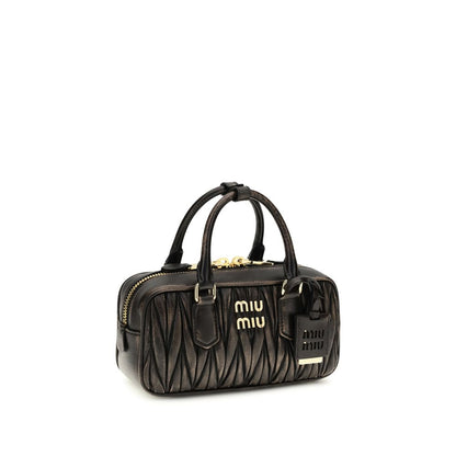 Quilted Satchel Pouch Handbag by Miu Miu for women in nappa lambskin leather & cotton brown, gold & patterned presents a ornamental silhouette, showcasing a secure zipper, ample , and versatile shoulder-strap, adjustable-strap & handle for a ornamental finish.