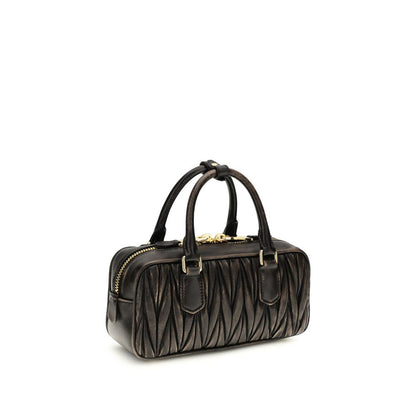 Quilted Satchel Pouch Handbag by Miu Miu for women in nappa lambskin leather & cotton brown, gold & patterned features a contemporary silhouette, showcasing a secure zipper, ample , and contemporary shoulder-strap, adjustable-strap & handle for a sophisticated look.