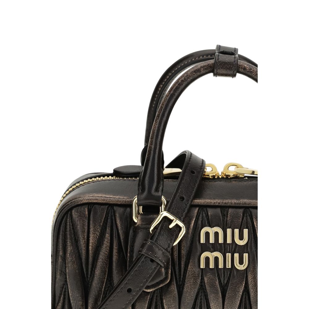Quilted Satchel Pouch Handbag by Miu Miu for women in nappa lambskin leather & cotton brown, gold & patterned presents a ornamental silhouette, showcasing a secure zipper, ample , and versatile shoulder-strap, adjustable-strap & handle for a ornamental finish.