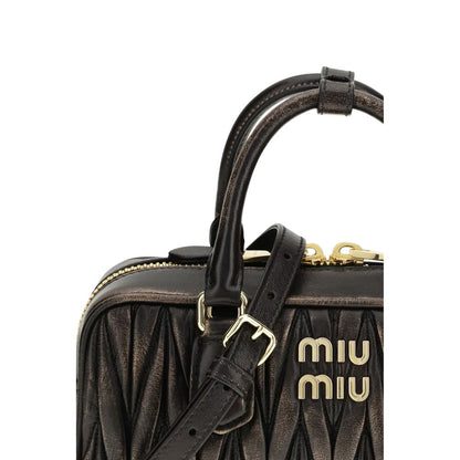 Quilted Satchel Pouch Handbag by Miu Miu for women in nappa lambskin leather & cotton brown, gold & patterned presents a ornamental silhouette, showcasing a secure zipper, ample , and versatile shoulder-strap, adjustable-strap & handle for a ornamental finish.