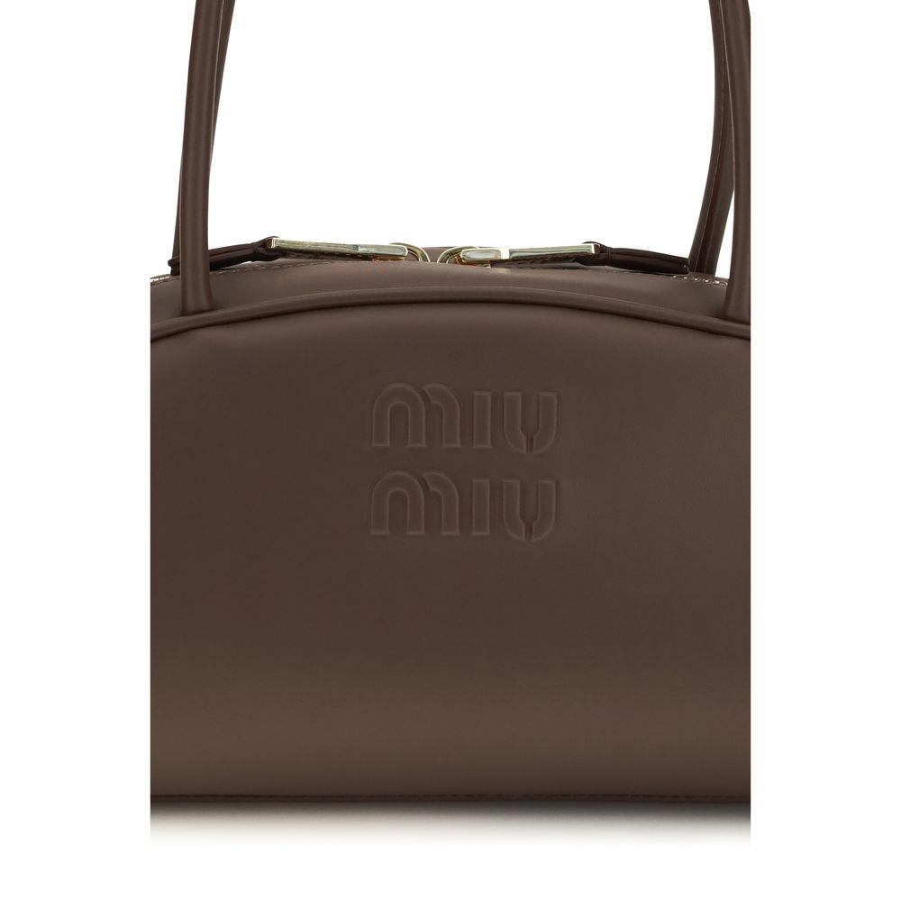 Shoulder Bowling Handbag by Miu Miu for women in polyurethane & bos taurus calf leather brown & gold features a signature silhouette, showcasing a secure zipper and signature cardholder with versatile shoulder-strap for a sophisticated look.