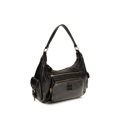 Shoulder Flap Bag by Miu Miu for women in bos taurus calf leather brown & gold features a distinguished silhouette, showcasing a secure flap and distinguished external-pockets with versatile shoulder-strap for a distinguished finish.