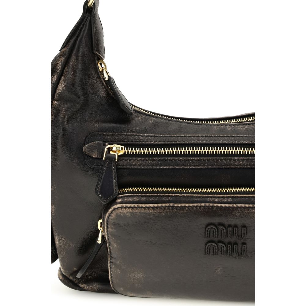 Shoulder Flap Bag by Miu Miu for women in bos taurus calf leather brown & gold features a enviable silhouette, showcasing a secure flap, ample external-pockets, and enviable shoulder-strap for a enviable finish.