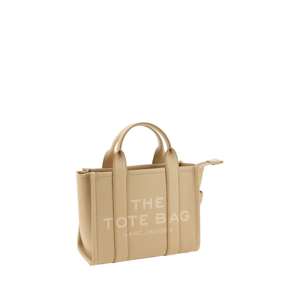 Small Crossbody Tote Handbag by Marc Jacobs for women in bos taurus calf grained leather beige & monogram presents a ornamental silhouette, showcasing a secure , ample , and versatile crossbody-strap, shoulder-strap, handle & adjustable-strap for a ornamental finish.