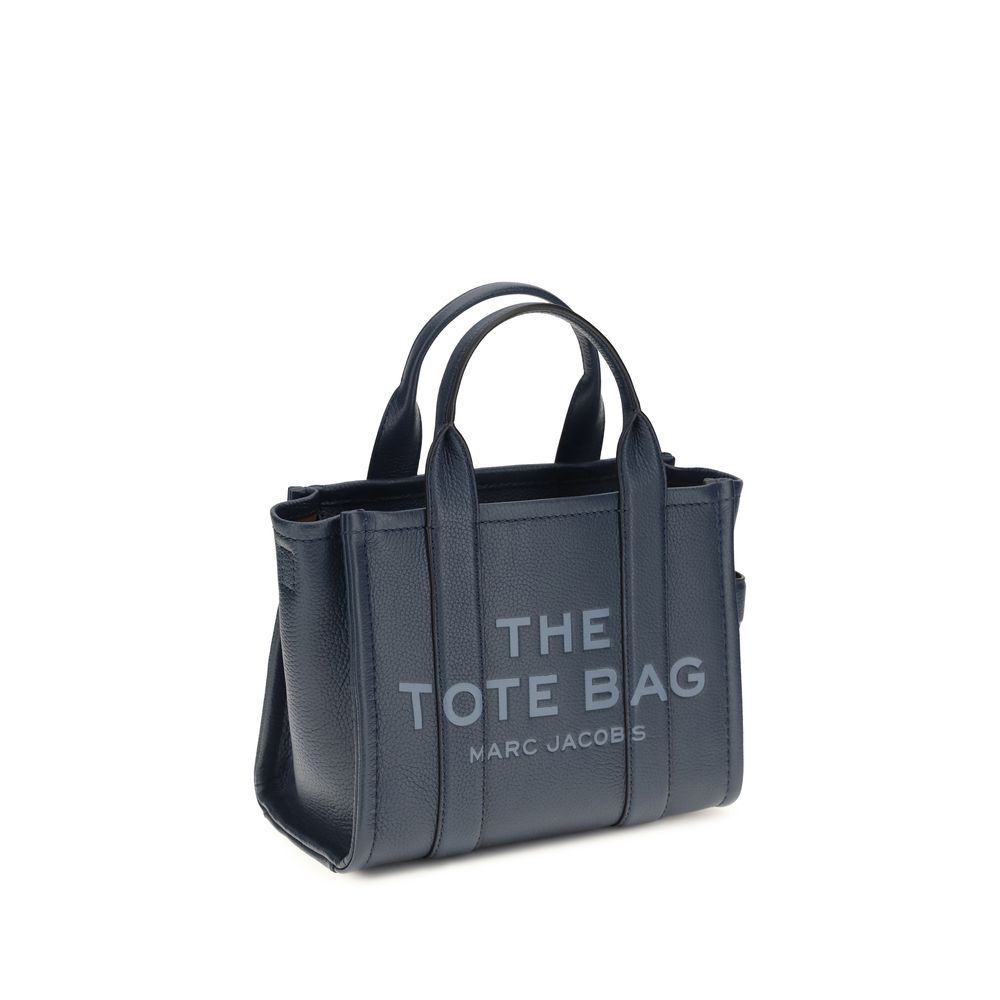 Small Crossbody Tote Handbag by Marc Jacobs for women in bos taurus calf grained leather blue & monogram features a signature silhouette, showcasing a secure and signature with versatile crossbody-strap, shoulder-strap, handle & adjustable-strap for a sophisticated look.