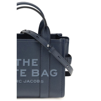 This Small Crossbody Tote Handbag by Marc Jacobs for women in bos taurus calf grained leather and blue & monogram presents a sculptural silhouette featuring a secure , ample , and versatile crossbody-strap, shoulder-strap, handle & adjustable-strap for a sculptural finish.