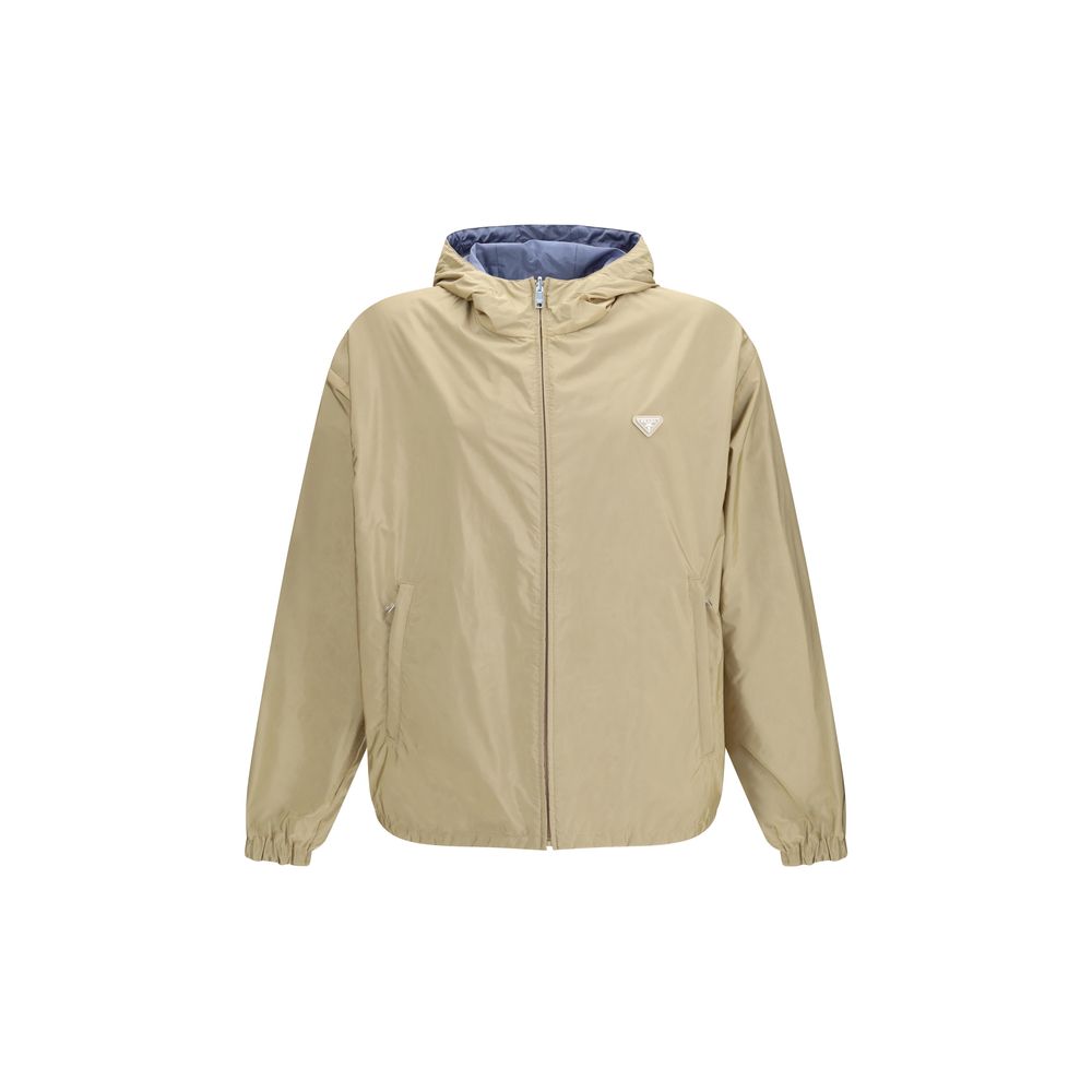 Hooded Puffer Jacket by Prada for men in nylon beige & signature showcases a bohemian silhouette, artfully detailed with a bohemian hooded neckline and signature pockets, hooded, insulated & windproof for a truly bohemian finish.