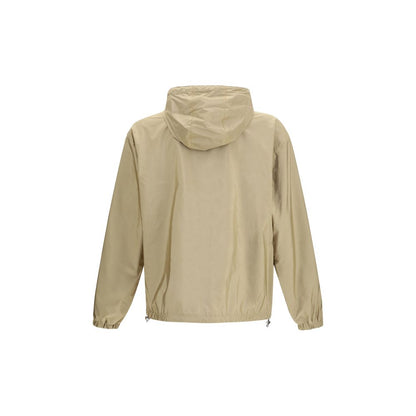 This Hooded Puffer Jacket by Prada for men in nylon beige & signature exhibits a edgy silhouette, meticulously detailed with functional pockets, hooded, insulated & windproof and a edgy hooded neckline for a edgy finish.