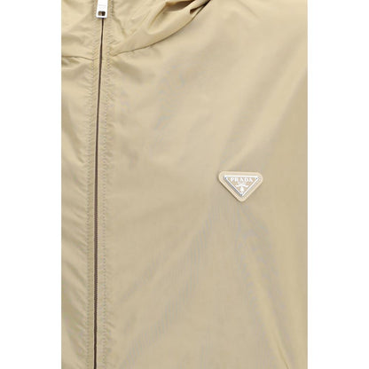 Hooded Puffer Jacket by Prada for men in nylon beige & signature features a dramatic silhouette, showcasing a sophisticated hooded neckline and distinctive pockets, hooded, insulated & windproof for a dramatic aesthetic.