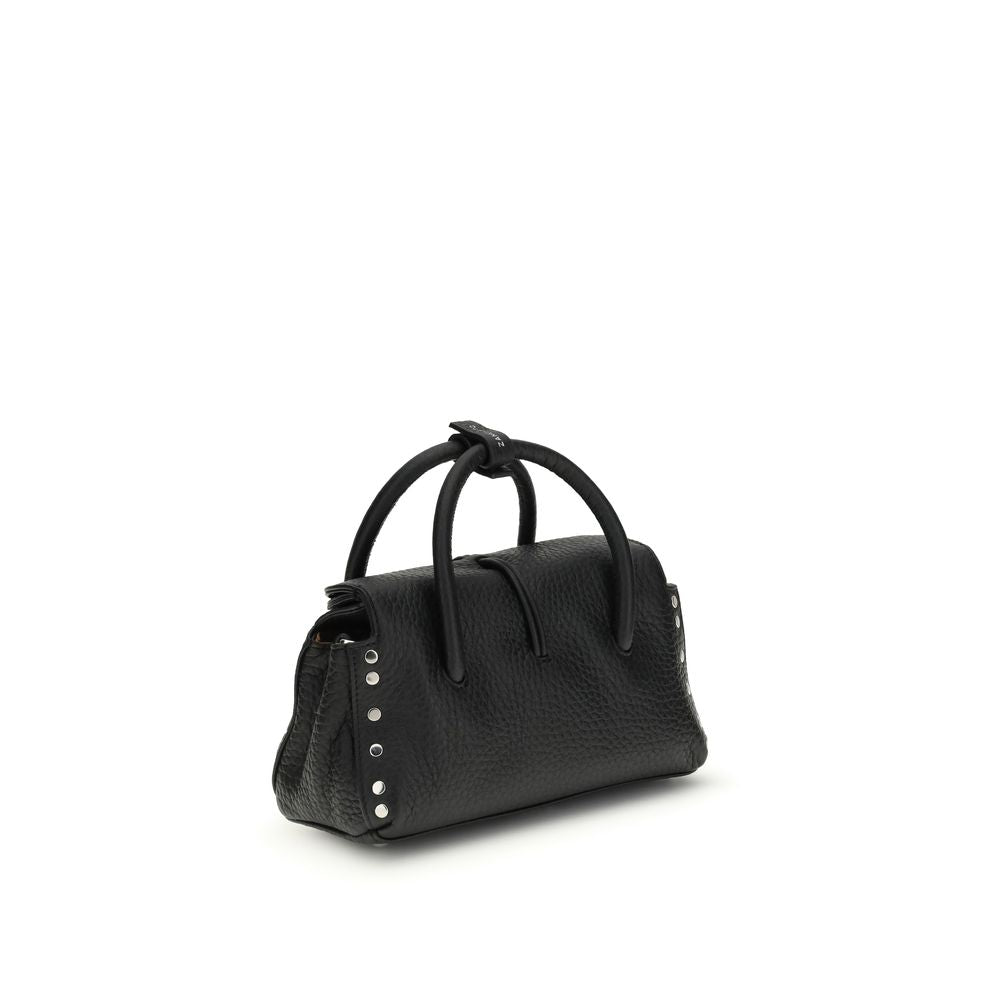 Handbag by Zanellato for women in bos taurus calf leather black features an refined silhouette, showcasing a secure magnetic, buckle & roll-top, ample , and versatile shoulder-strap & adjustable-strap for a sophisticated refined aesthetic.