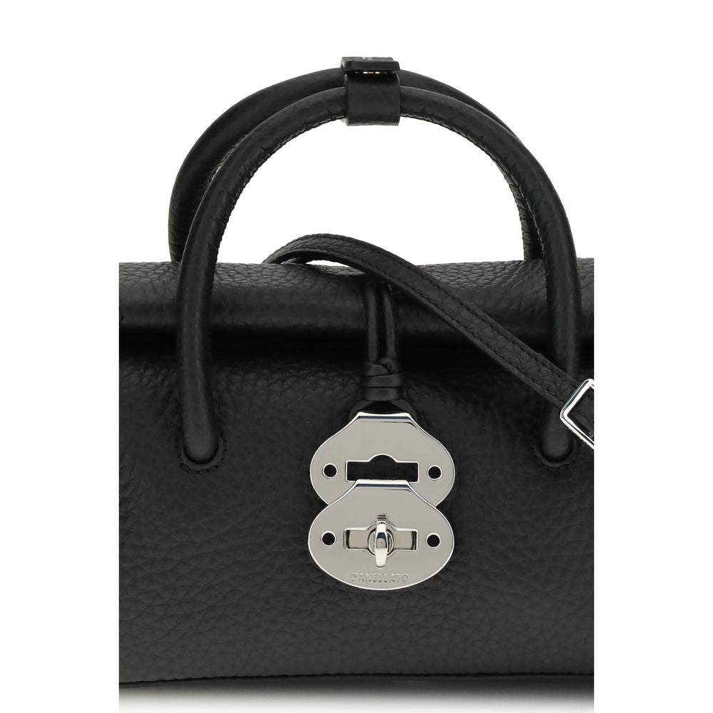 Handbag by Zanellato for women in bos taurus calf leather black features a contemporary silhouette, showcasing a secure magnetic, buckle & roll-top, ample , and contemporary shoulder-strap & adjustable-strap for a sophisticated look.