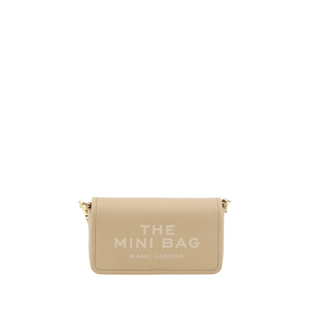 Mini Shoulder Flap Bag by Marc Jacobs for women in bos taurus calf grained leather beige & monogram features a distinguished silhouette, showcasing a secure flap, magnetic & button and distinguished single-compartment with versatile shoulder-strap & adjustable-strap for a distinguished finish.