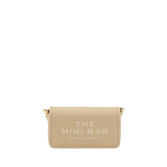 Mini Shoulder Flap Bag by Marc Jacobs for women in bos taurus calf grained leather beige & monogram features a distinguished silhouette, showcasing a secure flap, magnetic & button and distinguished single-compartment with versatile shoulder-strap & adjustable-strap for a distinguished finish.