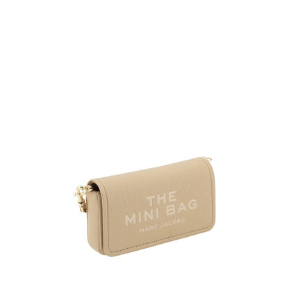 Mini Shoulder Flap Bag by Marc Jacobs for women in bos taurus calf grained leather beige & monogram features a effortless chic silhouette with a secure flap, magnetic & button, ample single-compartment, and versatile shoulder-strap & adjustable-strap for a effortless chic finish.