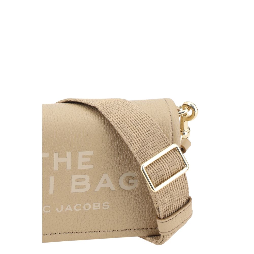 Mini Shoulder Flap Bag by Marc Jacobs for women in bos taurus calf grained leather beige & monogram features an effortlessly chic silhouette with a secure flap, magnetic & button, ample single-compartment, and versatile shoulder-strap & adjustable-strap for effortlessly chic everyday luxury.