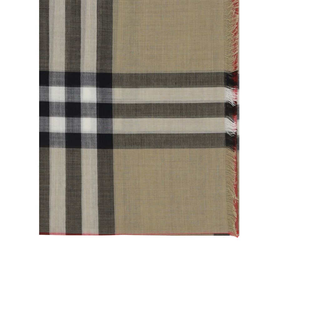 Scarf by Burberry for women in wool & silk brown & patterned showcases a warm silhouette from the Wool & Silk Frayed-Edge Scarf collection, offering a warm drape that exudes sophisticated luxury.