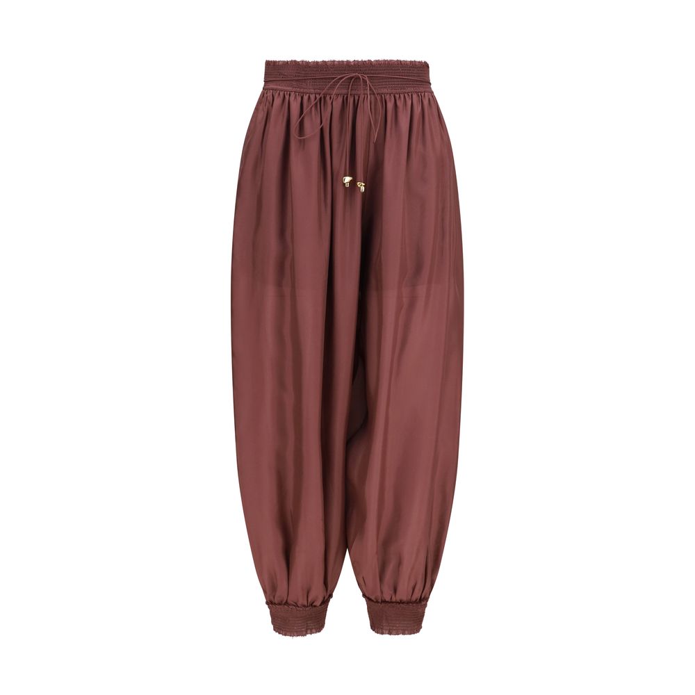 Herem Pants by Zimmermann for women in silk bordeaux features an utilitarian-chic silhouette, showcasing a utilitarian-chic tapered-leg & regular-fit with a long cut and mid rise for a refined look.