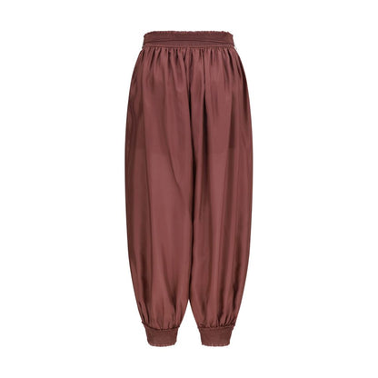 Herem Pants by Zimmermann for women in silk bordeaux features a modern silhouette, showcasing a modern tapered-leg & regular-fit with a long and mid rise for a refined finish.