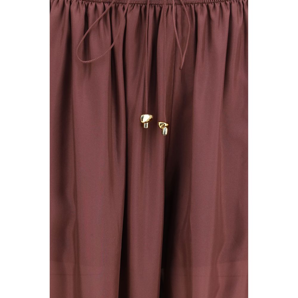 Herem Pants by Zimmermann for women in silk bordeaux features an sharp tapered-leg & regular-fit and long with a mid rise, highlighting a sharp silhouette for a sophisticated look.