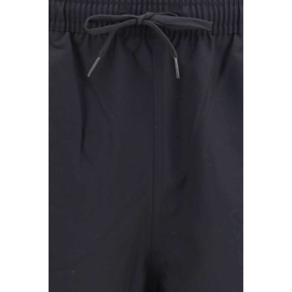 Swim Shorts by Fred Perry for men in polyester black & signature features a riviera-ready silhouette, showcasing the Laurel Perry Men's Polyester Swim Shorts design for a premium look.